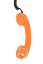 Orange telephone receiver over white Royalty Free Stock Photo