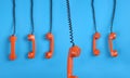 Orange telephones over blue background Royalty Free Stock Photo