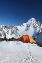 The orange tent in mountains