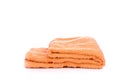 Orange terry towel isolated on a white background. Royalty Free Stock Photo