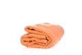 Orange terry towel isolated on a white background. Royalty Free Stock Photo