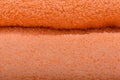 Orange terry towel. The texture of the cloth towels. Royalty Free Stock Photo