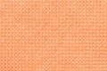 Orange textile background with checkered pattern, closeup. Structure of the fabric macro. Royalty Free Stock Photo