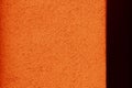 Orange texture with black vertical metal stripe on the right  place for text. Orange background. Royalty Free Stock Photo