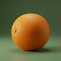 An orange with a textured, dimpled surface is placed against a solid green Royalty Free Stock Photo