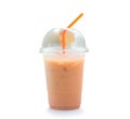 Orange Thai iced condensed milk tea in transparent plastic glass with straw isolated on white background with clipping path Royalty Free Stock Photo