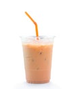 Orange Thai iced condensed milk tea in transparent plastic glass with straw isolated on white background with clipping path Royalty Free Stock Photo