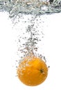 Orange thrown into water Royalty Free Stock Photo