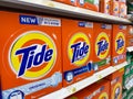 Orange Tide laundry detergent boxes lined up for sale in a store shelf in the grocery store