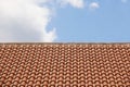 Orange tile roof over a blue sky Royalty Free Stock Photo