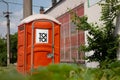 Orange ToiToi mobile toilet near the construction site