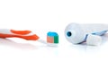 Orange toothbrush with toothpaste on white Royalty Free Stock Photo