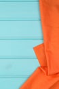 Orange towel over wooden table Royalty Free Stock Photo
