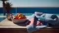 orange and towel on table with beach blur background summer time Royalty Free Stock Photo