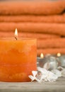 Orange towels with candle Royalty Free Stock Photo