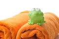 Orange towels and toy frog Royalty Free Stock Photo