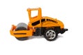 Orange toy asphalt roller on a white background Royalty Free Stock Photo