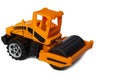 Orange toy asphalt roller on a white background Royalty Free Stock Photo