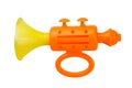 Orange toy musical trumpet. On a white background, isolated Royalty Free Stock Photo