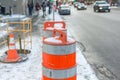 The orange traffic cone on the sidewalk in Montreal downtown