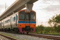 Orange train, railroad locomotive traveling ,Thailand