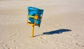 Trash can on the beach on a sunny day Royalty Free Stock Photo