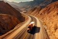 an orange truck driving down a highway in the desert. Generative Ai Royalty Free Stock Photo
