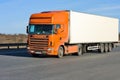 Orange truck with white container