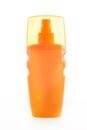 Orange tube bottle of shampoo, conditioner, hair rinse, gel, on a white background with reflection. Cream from sunburn Royalty Free Stock Photo