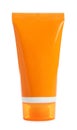 Orange tube with sun protection body cream on white background