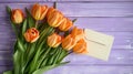 Orange tulips with dual tone petals on rustic white painted wood background