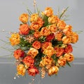 Orange tulips, roses, broom in spring flowers bouquet. Image in square.