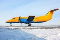 Orange turboprop aircraft