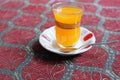 Orange Turkish tea in traditional glass