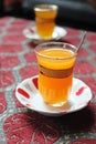 Orange Turkish tea in traditional glass