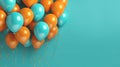 Orange and turquoise festive ballons on a turquoise background. Banner, copy space.