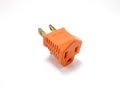Orange two prong electrical plug Royalty Free Stock Photo