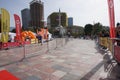 Orange umbrellas and flags in Tirana Marathon