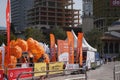 Orange umbrellas and flags in Tirana Marathon