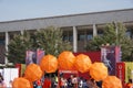 Orange umbrellas and flags in Tirana Marathon