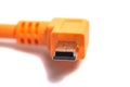 Orange USB cable isolated on white background Royalty Free Stock Photo