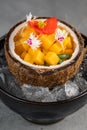 Orange vegetables and fruit with chia seeds and mango, ingredients on dark concrete background Royalty Free Stock Photo