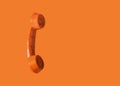 Orange vintage telephone handset, retro style Royalty Free Stock Photo