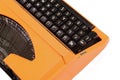 The Orange Vintage Typewriter on the White Background