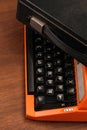 The Orange Vintage Typewriter on the Wood