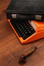 The Orange Vintage Typewriter on the Wood