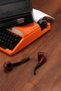 The Orange Vintage Typewriter on the Wood