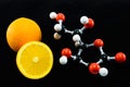 Orange and vitamin C structure model (Ascorbic acid) Royalty Free Stock Photo