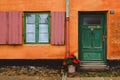 Orange Wall, Green Windows and Red Flower Pot