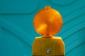 Orange warning light on the turquoise background. Close up Royalty Free Stock Photo